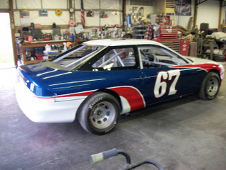 Illustration for article titled For $3,700, This 1996 Ford Probe Racer Might Give You A Checkered Future